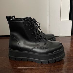 Ugg combat ankle boots. Never worn. Size 9. Black color.